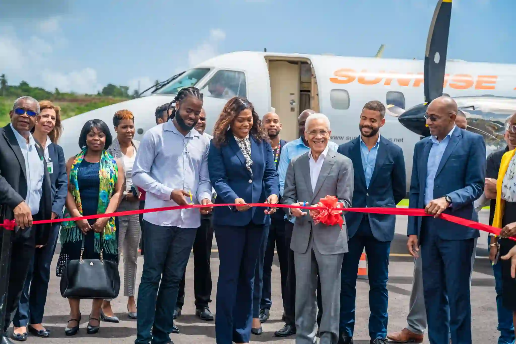 Sunrise Airways officials welcomed by Dr McIntyre